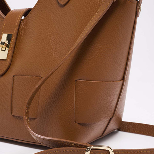 Xchic Pelle Camelia Prestige Leather handbag in tan, featuring sleek design and high-quality leather detailing.