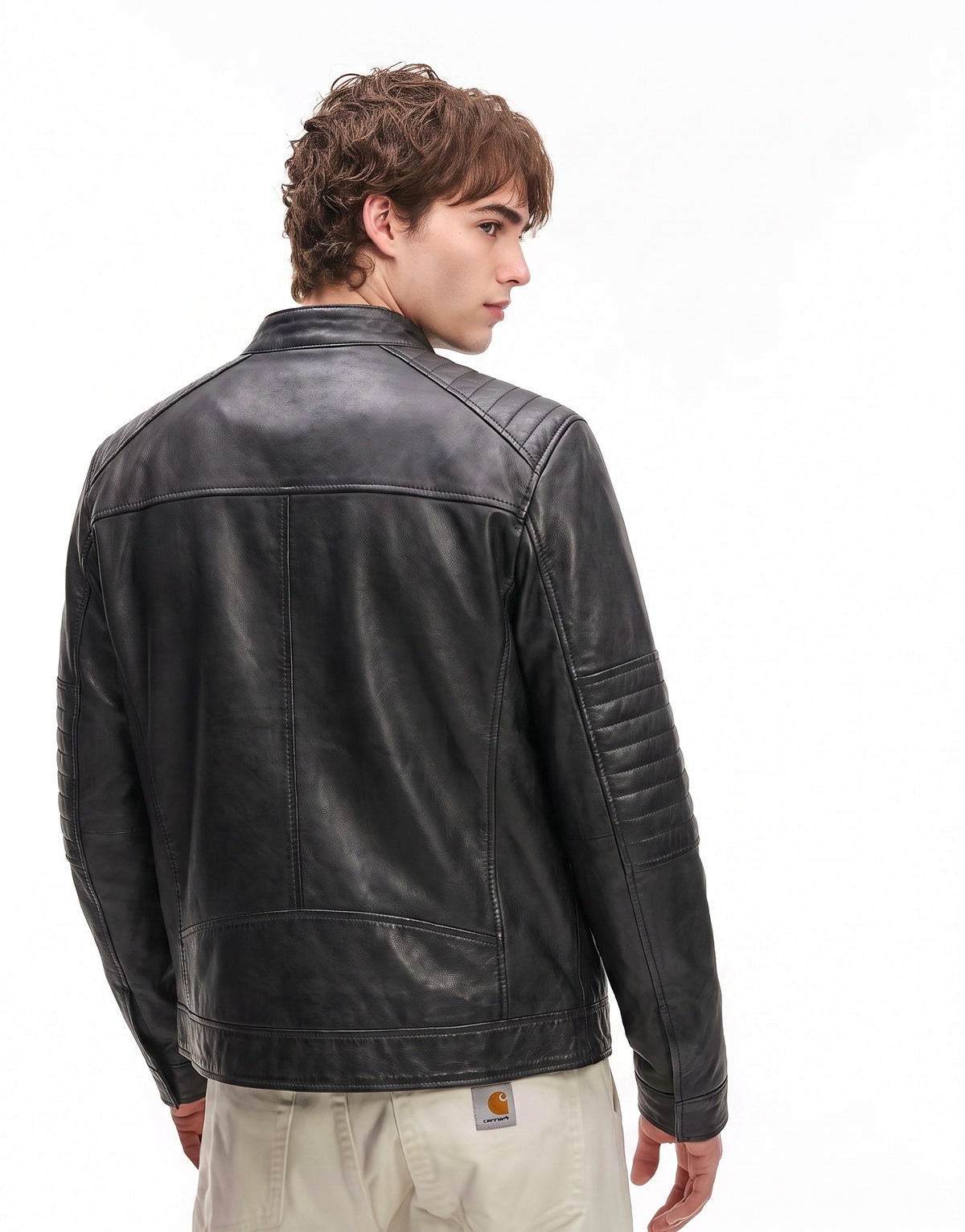 Xchic Pelle black leather biker jacket on a hanger, showcasing soft Nappa leather, classic collar, and zippered front design.