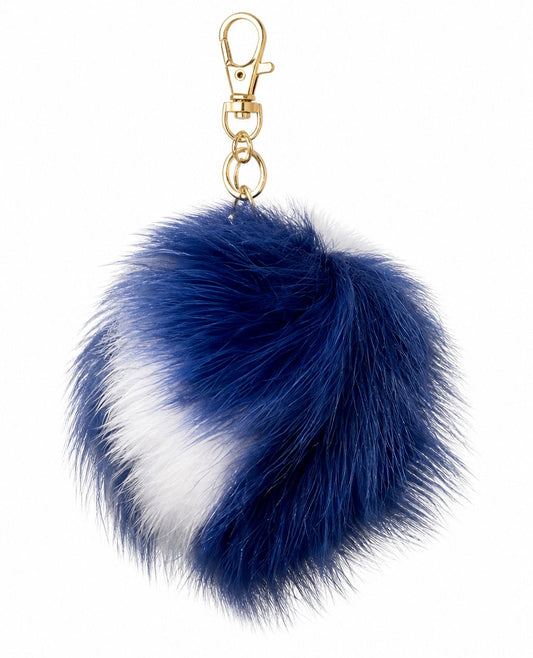 Blue and white luxury fur pom pom bag and key charm by Xchic Pelle, featuring soft fur accents and stylish design.