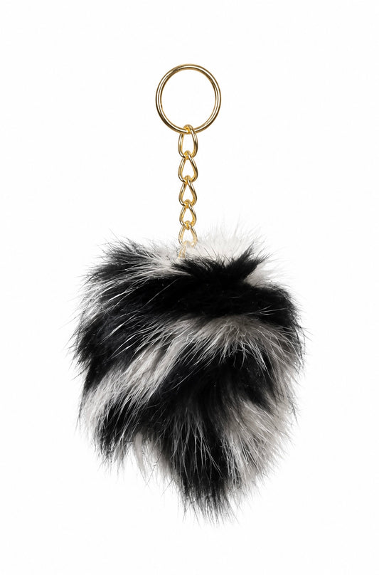 Black and white luxury fur pom pom bag charm by Xchic Pelle featuring a plush fur pom pom and keyring attachment.